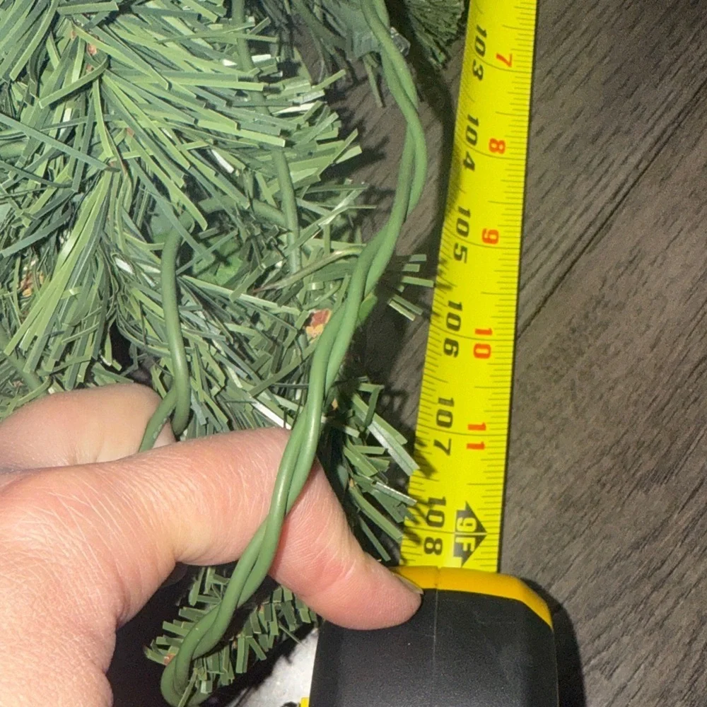 Festive Green Holiday Garland with Gold Accents and lights